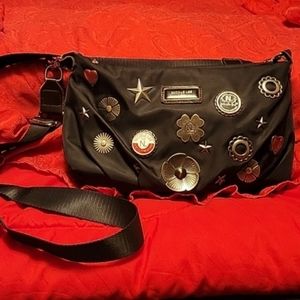 Nicole Lee USA black nylon stars bottlecaps silver pins cross body purse